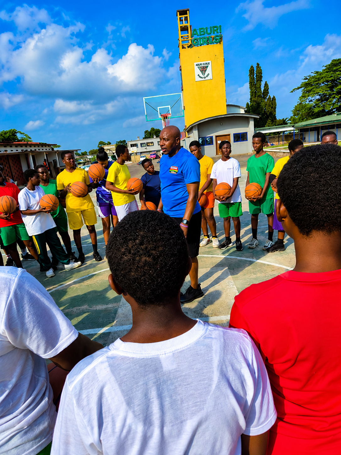 Coach Alico Dunk mentoring young basketball players at Aburi Girls’ school in Ghana
